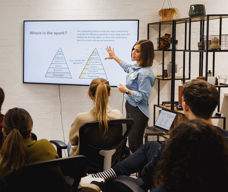 HeliosX teammates collaborating in a bright workspace.